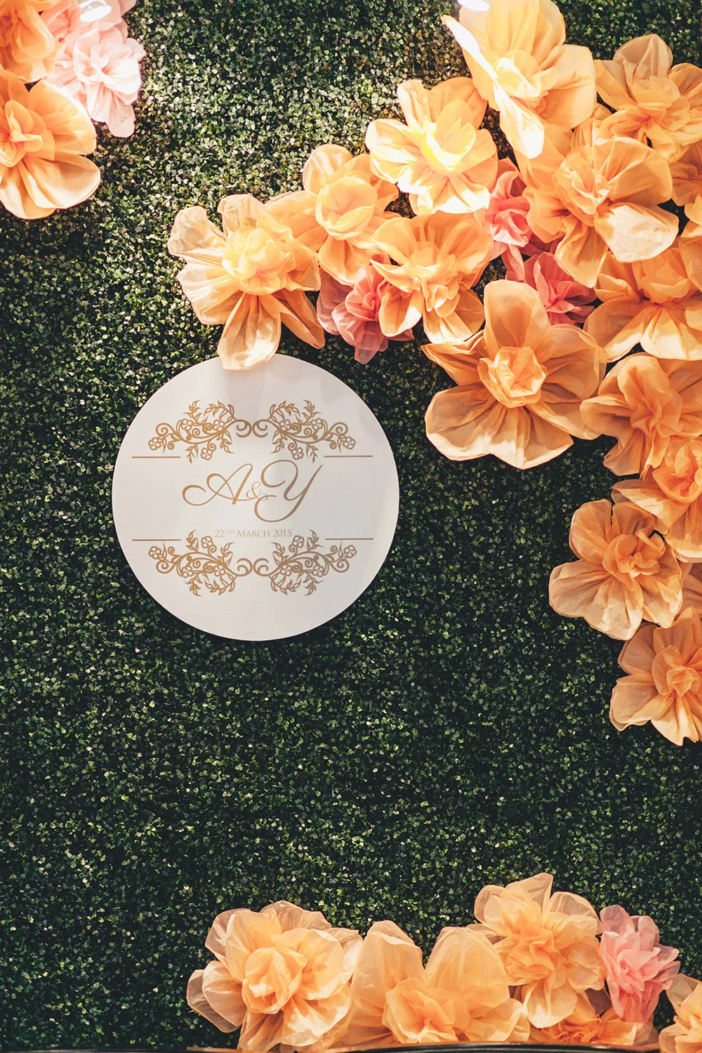 Orange colour photobooth. Photo by Adam Ong Photography. theweddingnotebook.com