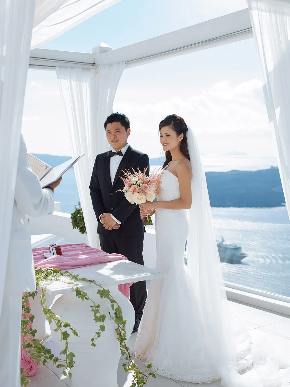 Destination wedding in Santorini. Photo by Sunrise Greece. theweddingnotebook.com