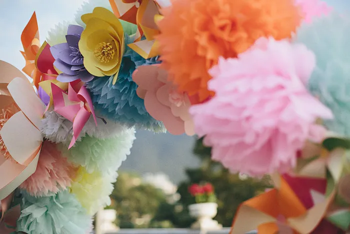 theweddingnotebook.com.Photography by History Studio. Colourful wedding arch