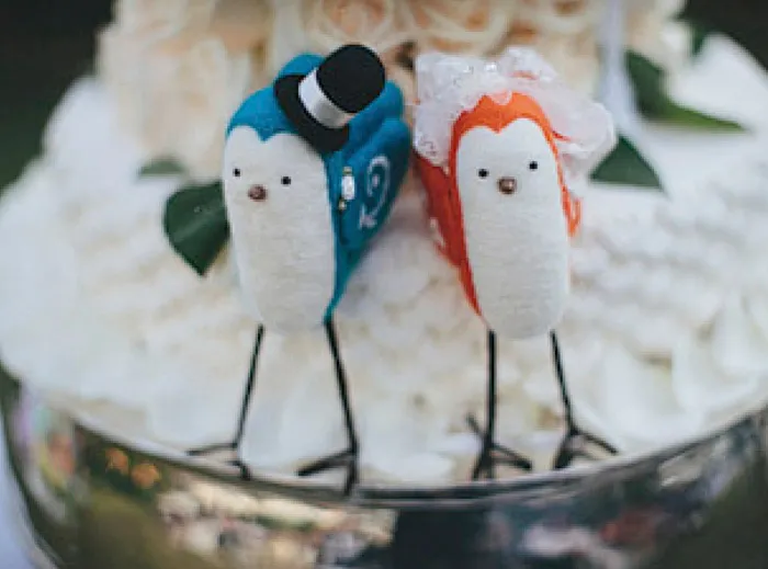 theweddingnotebook.com.Photography by History Studio. Love birds wedding cake topper