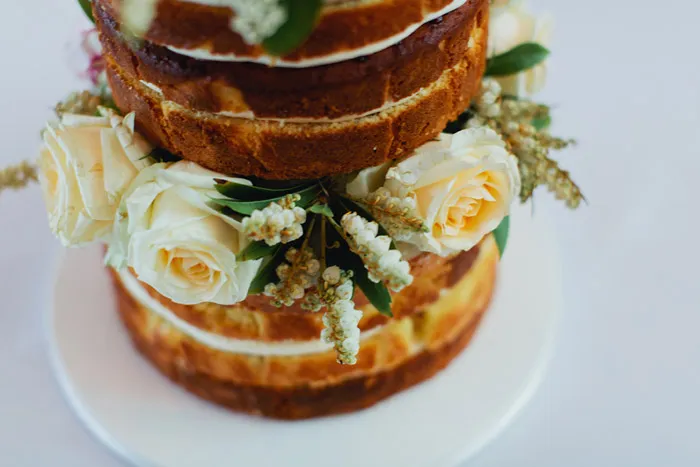 Naked wedding cake. Photo by Sayher Heffernan. theweddingnotebook.com